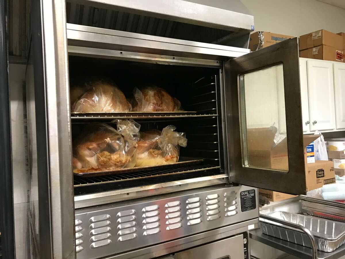 Volunteers cook the turkeys for the Bette J. Naffie Memorial Thanksgiving Dinner all day on the Tuesday before Thanksgiving.