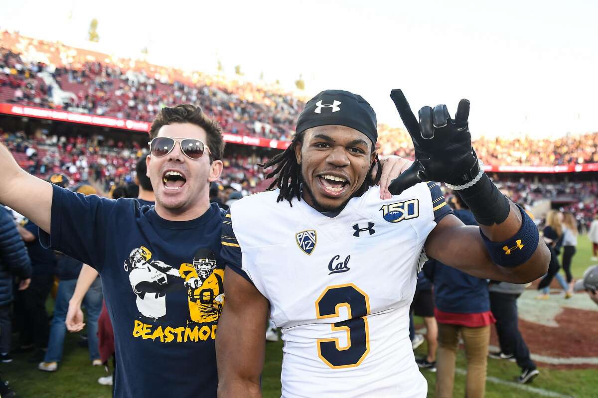 Bears defensive back Elijah Hicks celebrates with a supporter after Cal defeated Stanford 24-20 in last year’s Big Game.