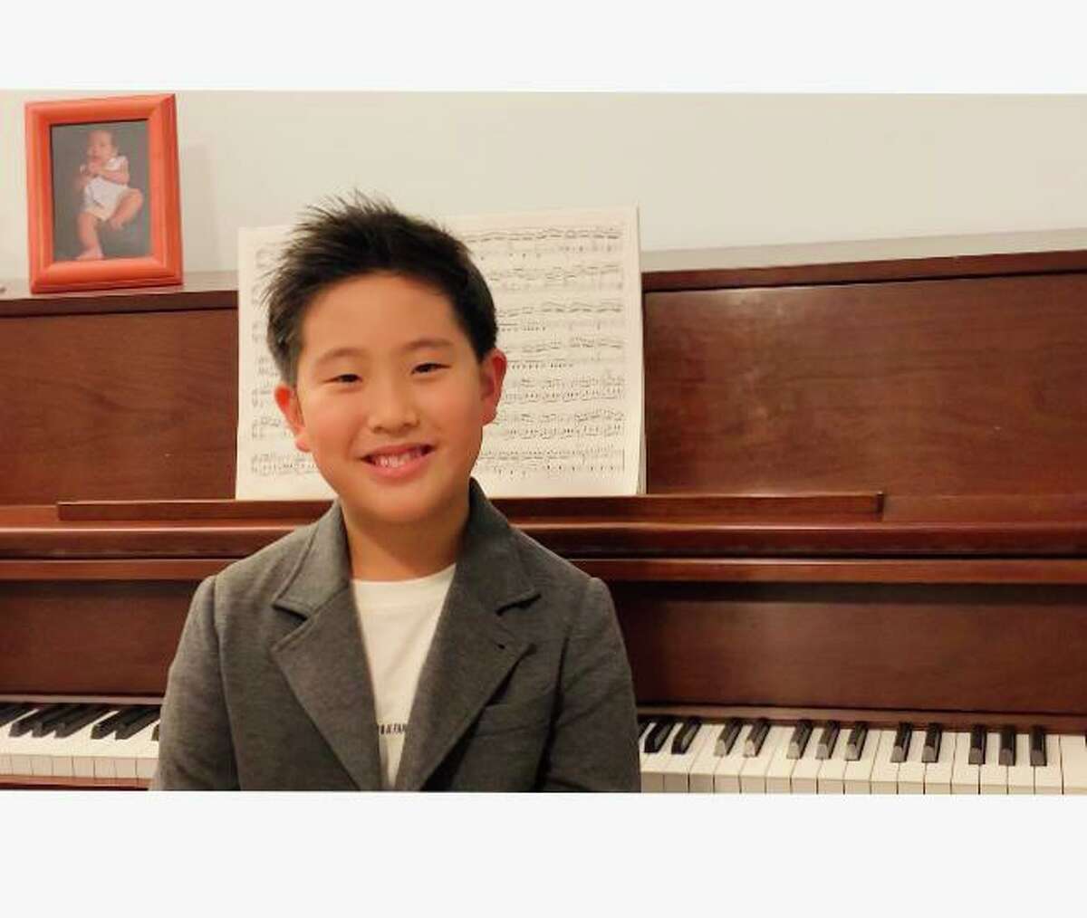 Shelton resident Minho Chung, 8, will perform in the 14th Playing By Heart, a concert featuring the advanced students of Wilton pianist and teacher Kyong Hee Cho. The performance will be Sunday, Nov. 29, at 4 p.m. on YouTube.