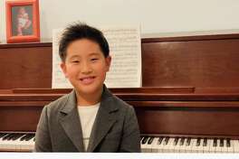 Shelton resident Minho Chung, 8, will perform in the 14th Playing By Heart, a concert featuring the advanced students of Wilton pianist and teacher Kyong Hee Cho. The performance will be Sunday, Nov. 29, at 4 p.m. on YouTube.