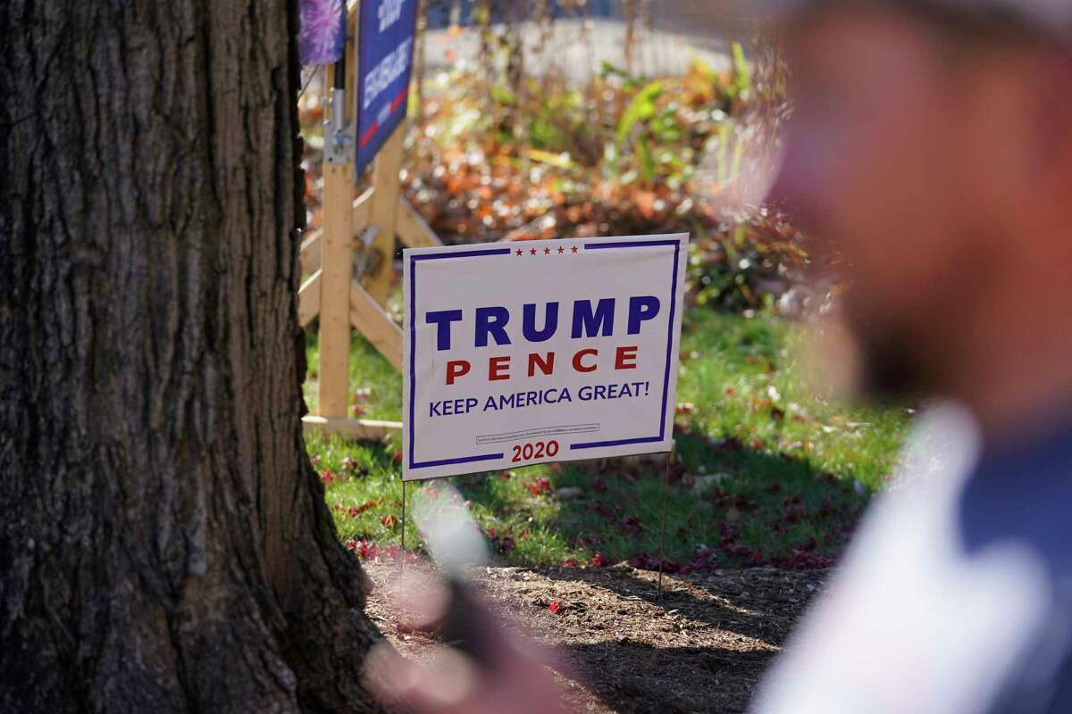 A President Donald Trump sign sits in a yard Nov. 11, 2020 - a week after the election - in Terre Haute, Ind.