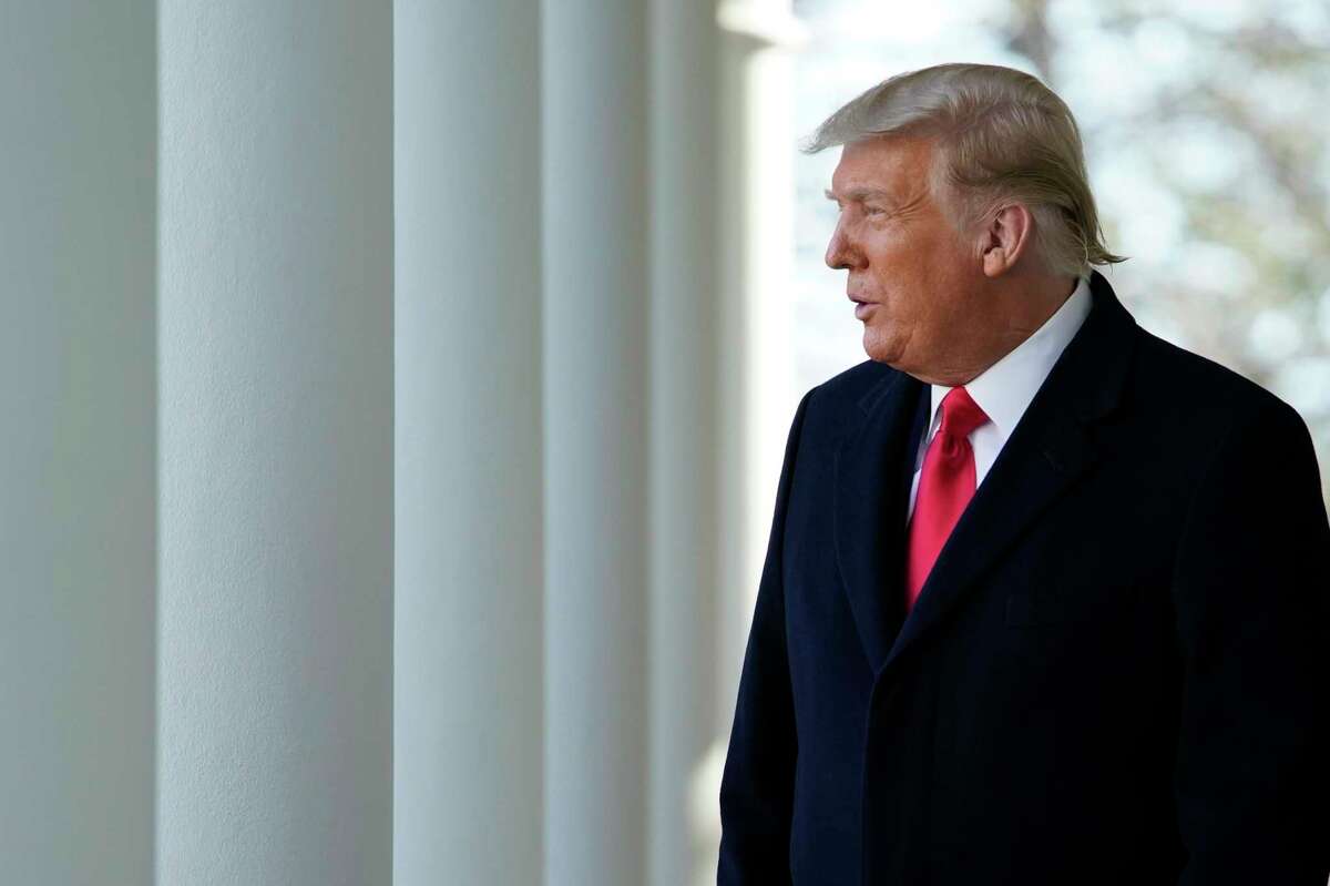 President Donald Trump walks out of the Oval Office and towards the Rose Garden of the White House, Tuesday, Nov. 24, 2020, in Washington, to pardon Corn, the national Thanksgiving turkey. (AP Photo/Susan Walsh)