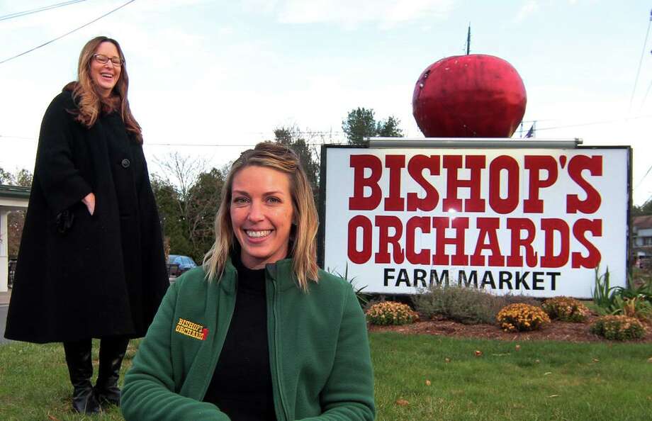 Nikki Rasmussen, left, who owns Little Whimsy Boutigue Bakery, and is the organizer of the first annual "A Holiday Market" artisan fair, poses with Sarah Bishop Della Ventura at Bishops Orchards Farm Market & Winery in Guilford, Conn., on Thursday Nov. 19, 20. The fair will be held at Bishops Orchards on Nov. 28. Photo: Christian Abraham / Hearst Connecticut Media / Connecticut Post