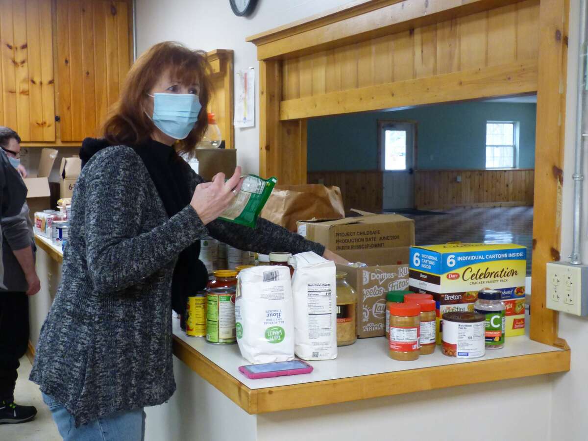 Volunteers with the Dublin Heights Sports Club and Wellston Branch Library collected roughly 600 pounds of food during their inaugural community food drive Tuesday. Organizers plan to make the event an annual occurrence. (Scott Fraley)