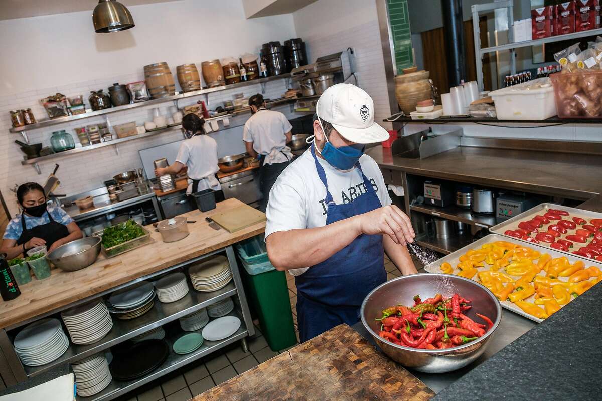 Owner of Mister Jiu’s Restaurant Brandon Jew prepares food in his restaurant in San Francisco on Friday, September 18, 2020. Mayor London Breed announced that San Francisco restaurants may once again welcome diners inside as soon as the end of the month.