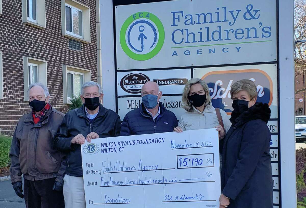 Family & Children's Agency, led by the Minks to Sinks volunteers, was the beneficiary of the Wilton Kiwanis Club's very successful Pumpkin Patch charity weekend, Oct. 9-12. The weekend's proceeds of $5,790 were presented recently. At the check presentation were, from left, Den Taylor, Kiwanis president-elect; Paul Hannah; Rob Cashel, CEO of FCA; Michelle Doggett, chair of Minks to Sinks; and Kiwanis vice president Carol Boehly.