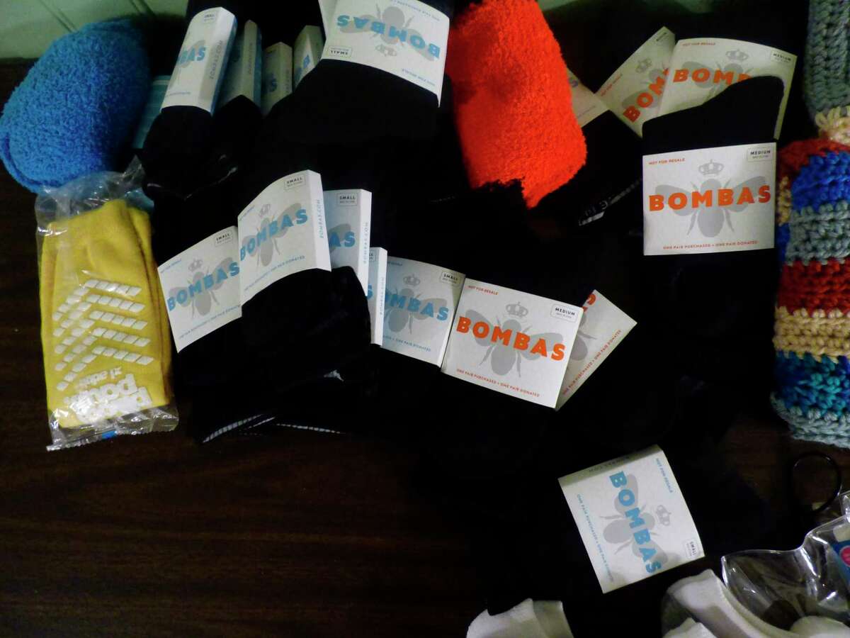ECHO His Love's Safe Harbor shelter program was gifted socks by Bombas, an apparell company which gifts clothing to homeless shelters. (Scott Fraley/News Advocate)
