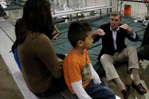 Gil Kerlikowske, former Commissioner of U.S. Customs and Border Protection, sat on the floor to speak with an immigrant family held in a McAllen processing center in 2015. Kerlikowske lauds President-elect Joe Biden’s pick for Secretary of Homeland Security, Alejandro Mayorkas.