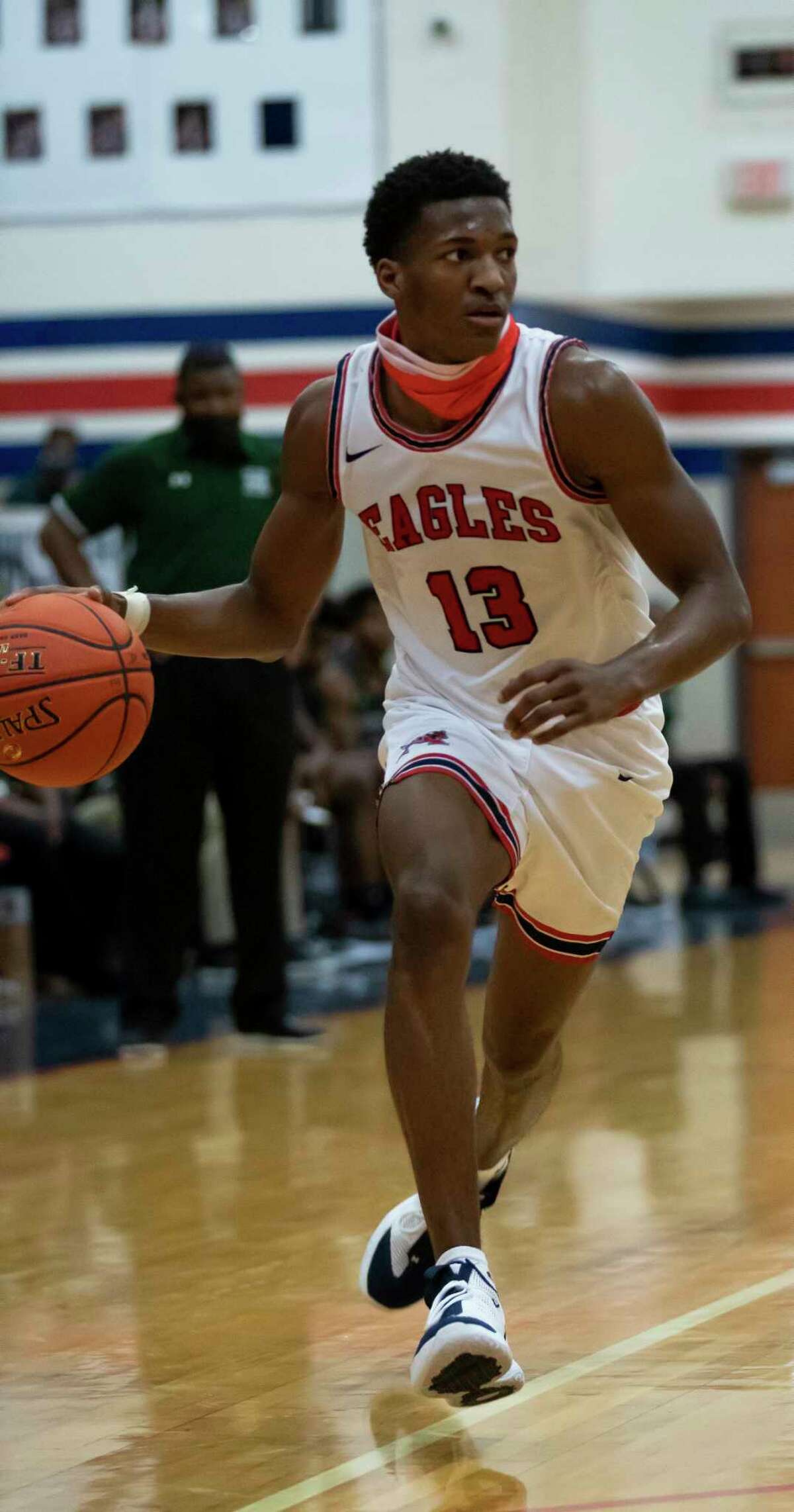 Atascocita Justin Collins (13) drives the ball during the fourth quarter of a non-district basketball game against Fort Bend at Atascocita High School, Wednesday, Nov. 25, 2020, in Atascocita.