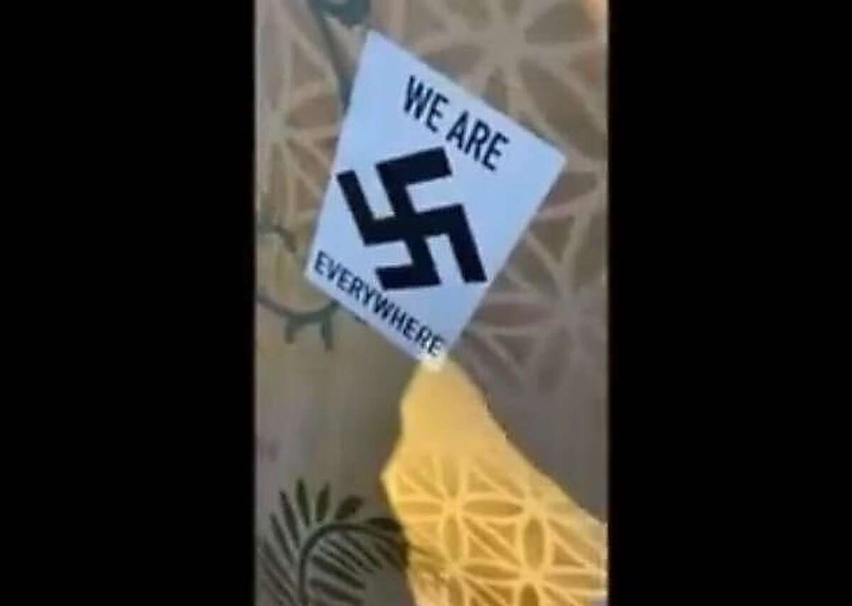This screenshot of an Instagram video shows one of the stickers placed on public and private property in downtown Fairfax. The video was captured by Fairfax resident Noah Mohan, 21, who told The Chronicle that he approached the man with the stickers because he did not want that type of ideology in the city he was raised.