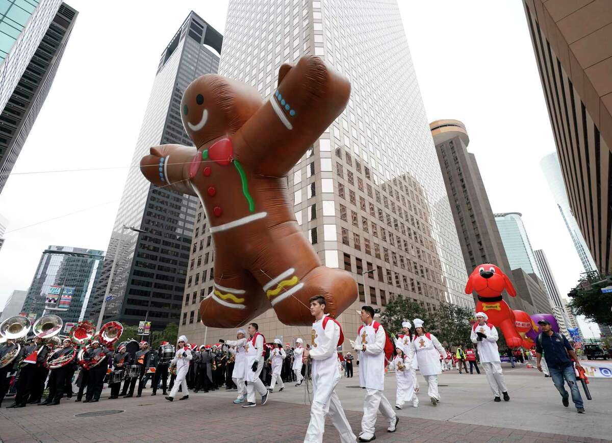 Balloons are carried during the 70th Annual H-E-B Thanksgiving Day Parade downtown Thursday, Nov. 28, 2019, in Houston.