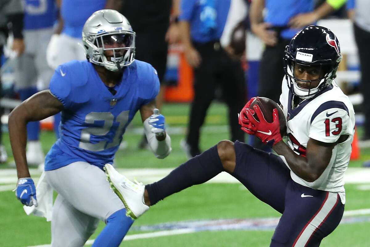 Houston Texans wide receiver Brandin Cooks (13) beats Detroit Lions defensive back Tracy Walker (21) for a first down reception during the second quarter of an NFL football game at Ford Field Thursday, Nov. 26, 2020, in Detroit.