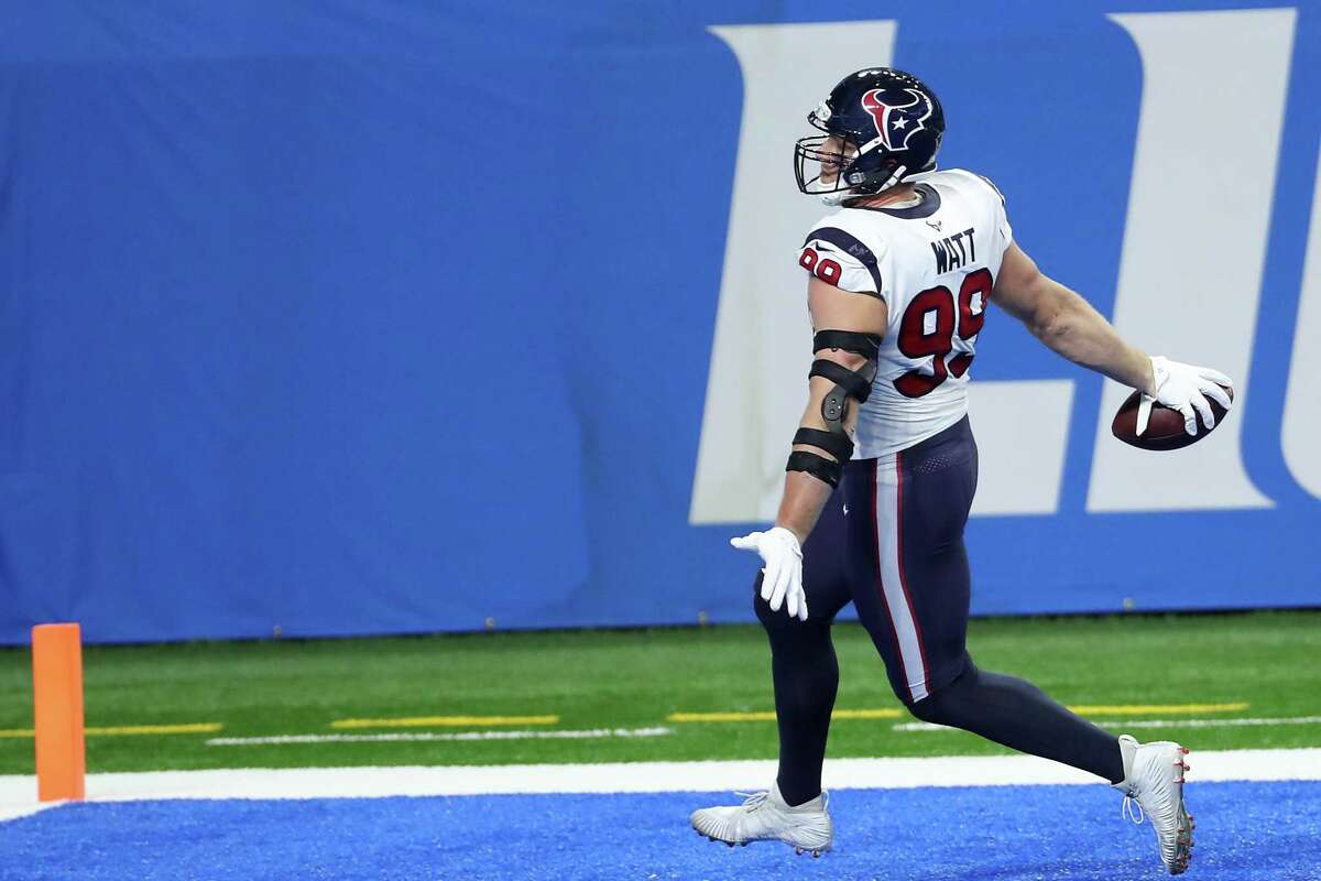 J.J. Watt celebrates his touchdown on an interception return against the Lions that set the tone for the Texans’ win.