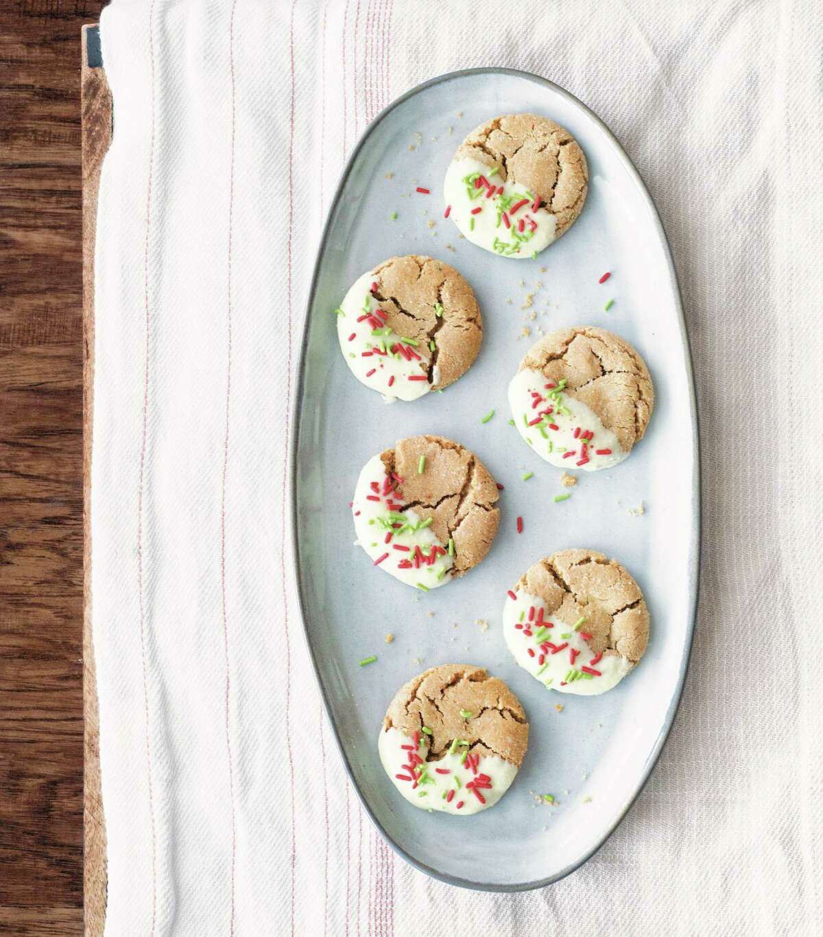 White Chocolate-Dipped Ginger Crinkles (recipe in column): These pretty Christmas treats are dipped in white chocolate and sprinkled with red and green sprinkles — like they’re all wrapped up for Christmas.
