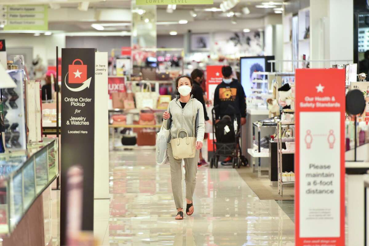 A woman walks through Macy’s at North Star Mall during early Black Friday shopping.
