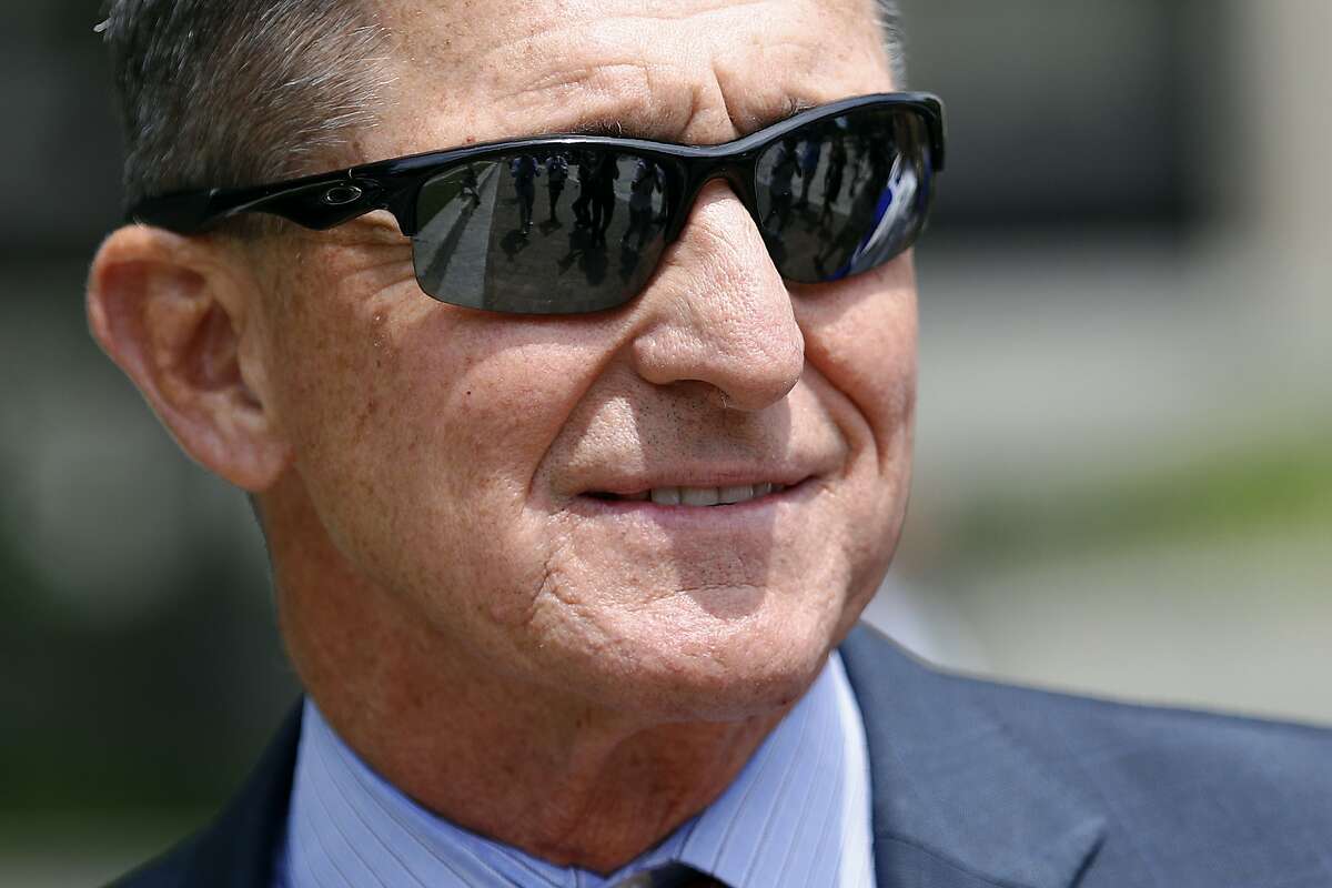 FILE - Michael Flynn, President Donald Trump's former national security adviser, departs a federal courthouse after a hearing, Monday, June 24, 2019, in Washington. President Donald Trump has pardoned Michael Flynn, taking direct aim in the final days of his administration at a Russia investigation that he has long insisted was motivated by political bias. Trump announced the pardon on Wednesday, Nov. 25, 2020 calling it his “Great Honor.” (AP Photo/Patrick Semansky)