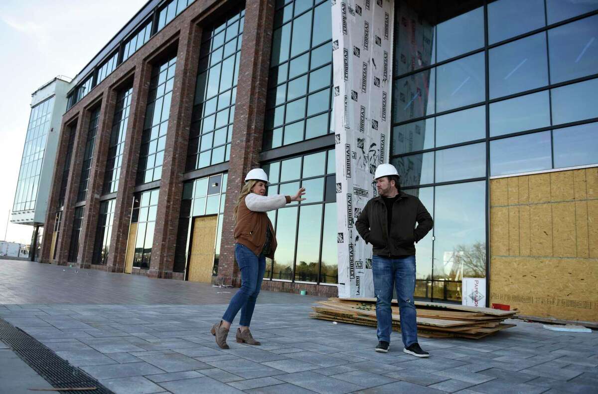 Wheelhouse Properties head Courtney Montgomery and Wheelhouse CEO Brent Montgomery lead a tour of The Village center in Stamford, Conn., on Tuesday, Nov. 24, 2020. Located at 860 Canal St., the 133,000-square-foot facility is set to open in the spring of 2021.