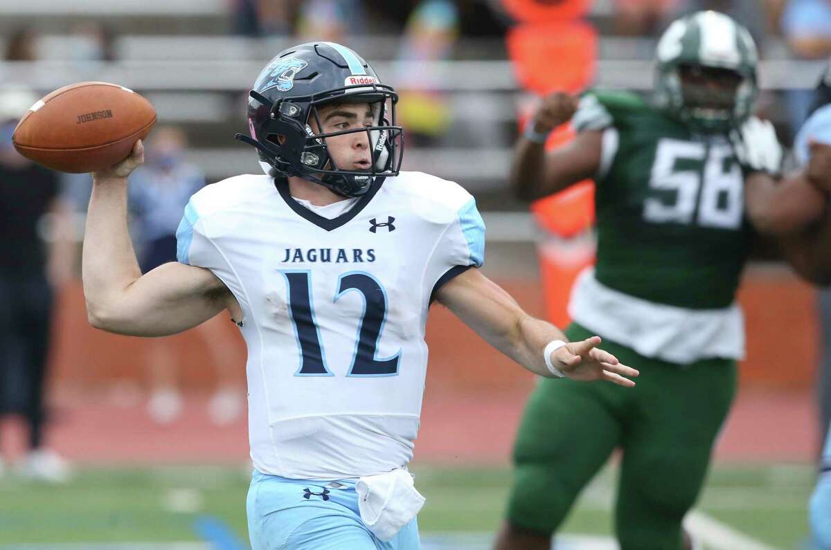 Ty Reasoner throws for the Jags as Reagan plays Johnson at Heroes Stadium on Nov. 27, 2020.