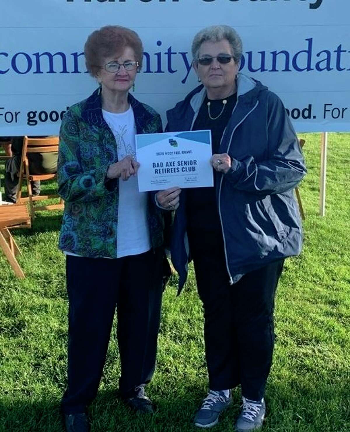 Pictured accepting the grant award is (left) Donna Poppeck, club treasurer, and (right) Mary Gilbert, club secretary. (Submitted Photo)