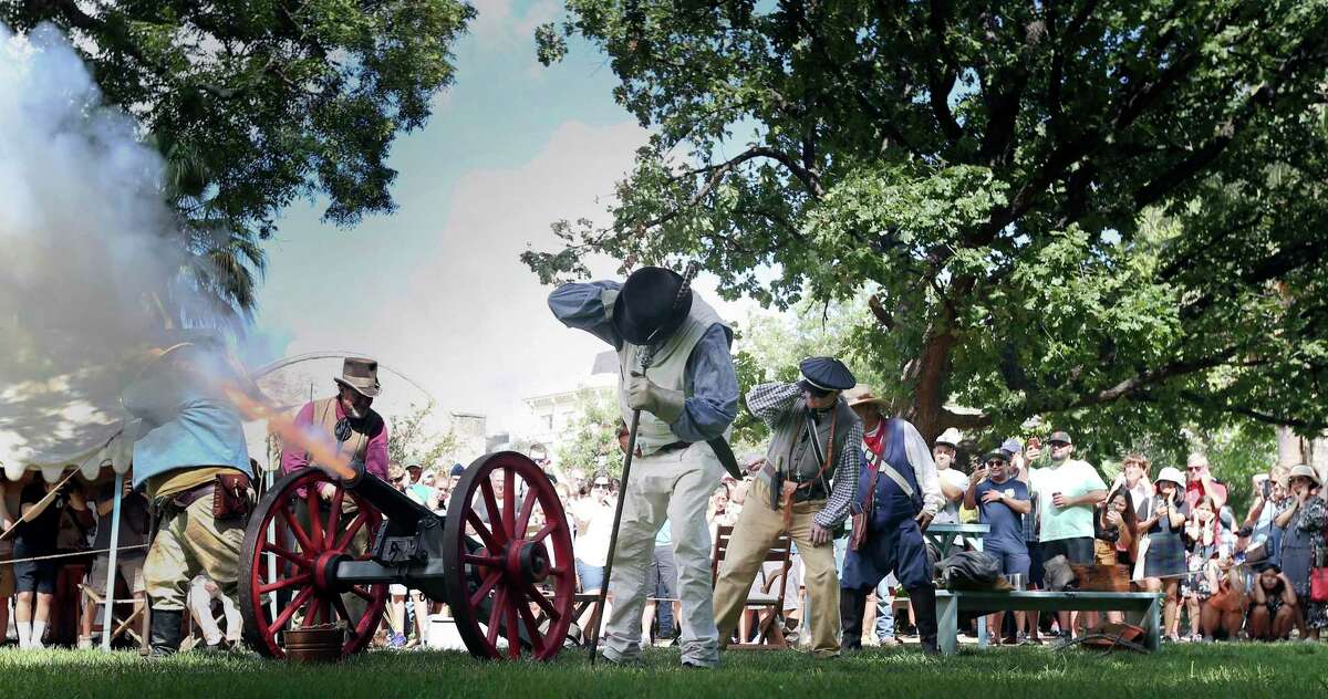 An artillery crew fires a Napoleon-style, smooth bore, muzzle loading, two-pound cannon as a crowd watches - some with their hands clasped to their ears - during the Alamo's 3rd annual Cannon Festival on Saturday, Sept. 28, 2019. New research at the Alamo reveals that the long-lost “18-pounder” cannon fired at the start of the 13-day siege in 1836 was actually a Swedish 9-pounder cannon that was altered to fire larger ammunition. That means the largest cannons at the Alamo in 1836 were two 16-pound guns. One is on display at the Alamo. The other is owned by San Antonio billionaire B.J. “Red” McCombs.
