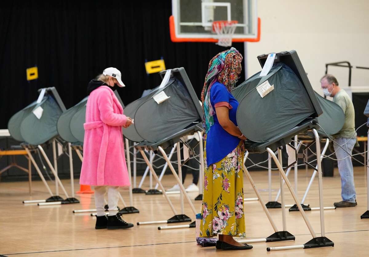 People vote on Election Day at the Metropolitan Multi-Services Center, 1475 West Gray St., on Nov. 3, 2020 in Houston.