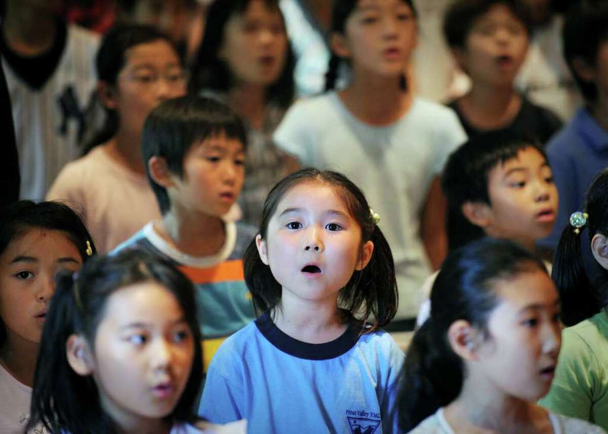 Japanese School student, Mayu Nakagawa, 7, sings the Japanese National Anthem during the founding celebration of the Japanese School of New York, located on Lake Avenue in Greenwich, Thursday afternoon, Sept. 2, 2010. The school celebrated its 35th anniversary.