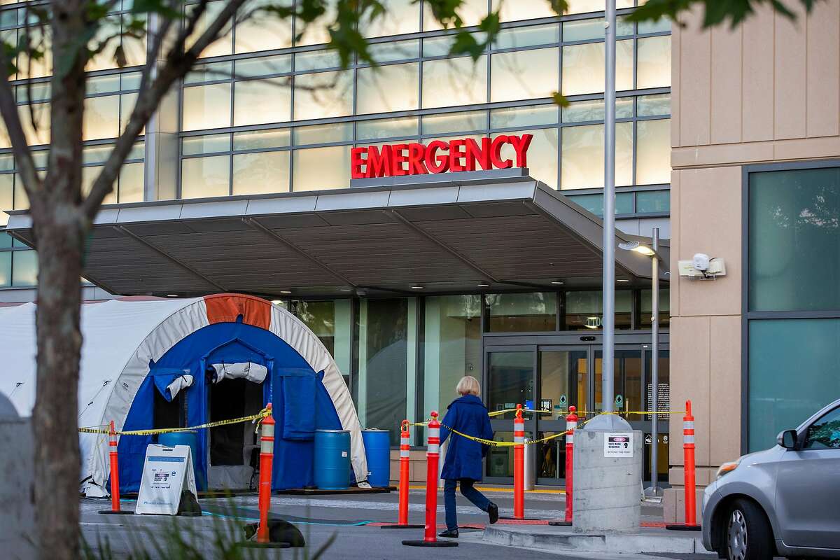 Tents are set up outside the emergency room at Kaiser Permanente for overflow of COVID-19 patients in Redwood City as shown on Nov. 19. California hospitals are treating a record number of coronavirus patients, straining resources.