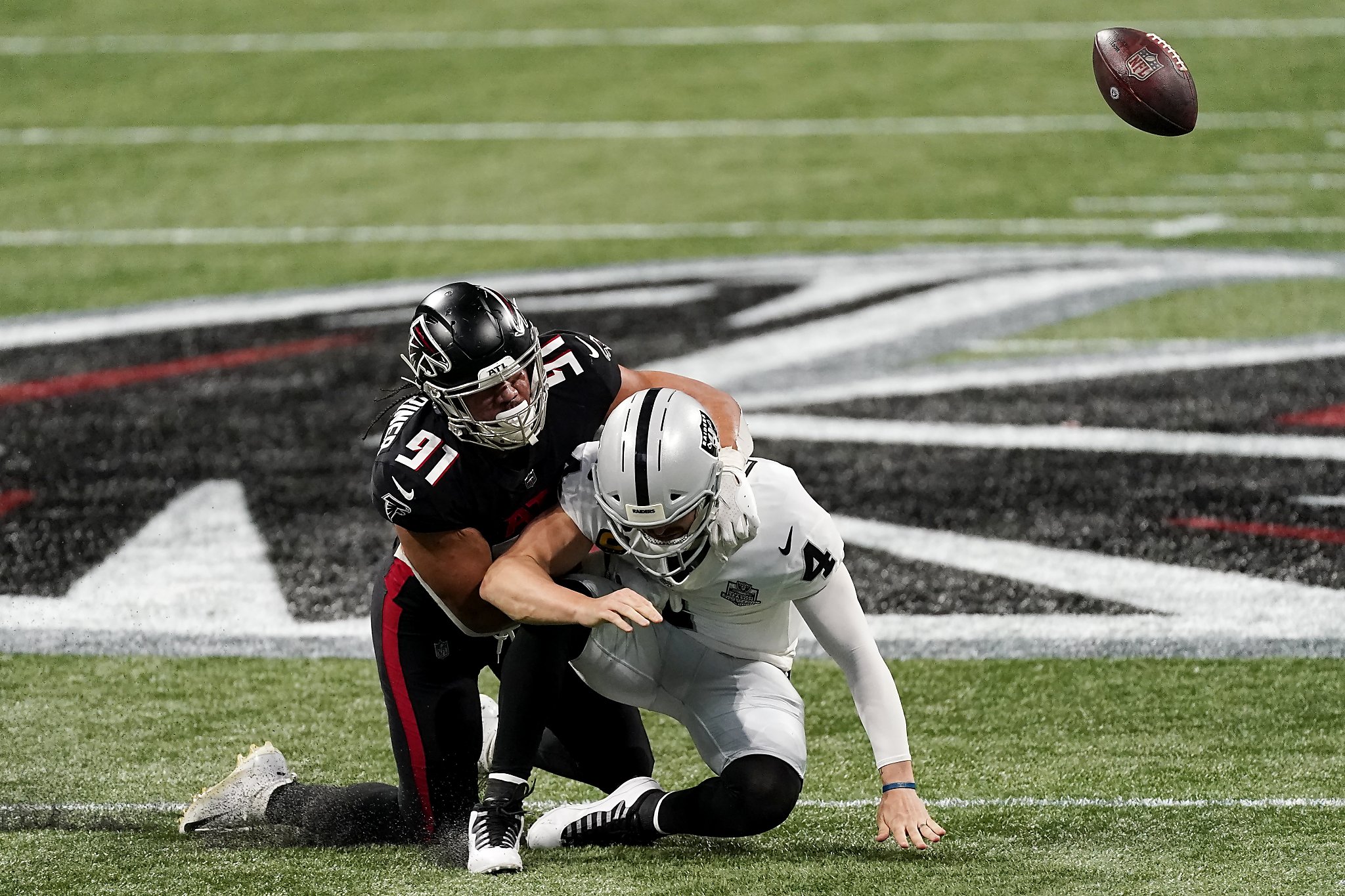Raiders&rsquo; Derek Carr has four turnovers in lopsided loss to Falcons