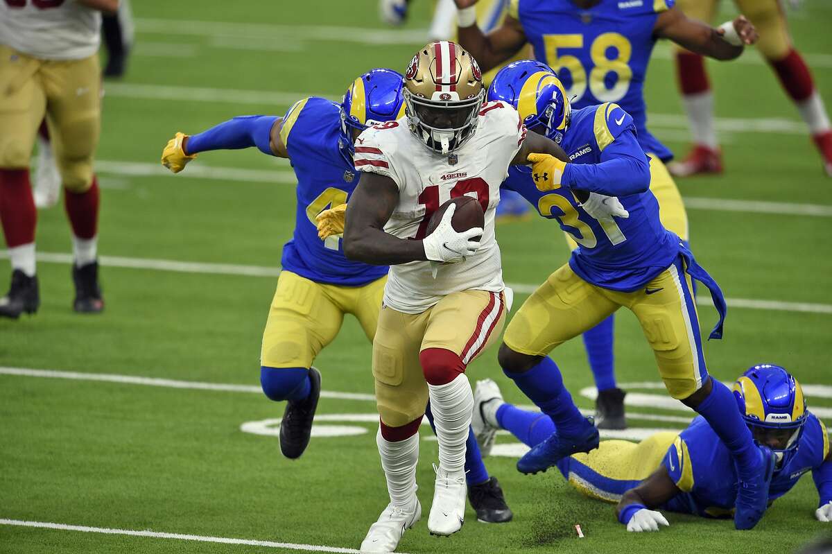 San Francisco 49ers wide receiver Deebo Samuel (19) carries after a catch during the second half of an NFL football game against the Los Angeles Rams Sunday, Nov. 29, 2020, in Inglewood, Calif. (AP Photo/Kelvin Kuo)