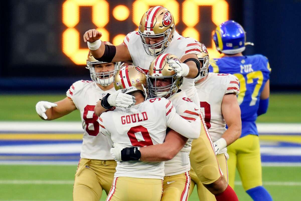 Robbie Gould #9 of the San Francisco 49ers celebrates with teammates after making a game-winning field goal during the fourth quarter to defeat the Los Angeles Rams 23-20 at SoFi Stadium on November 29, 2020 in Inglewood, California. (Photo by Harry How/Getty Images)