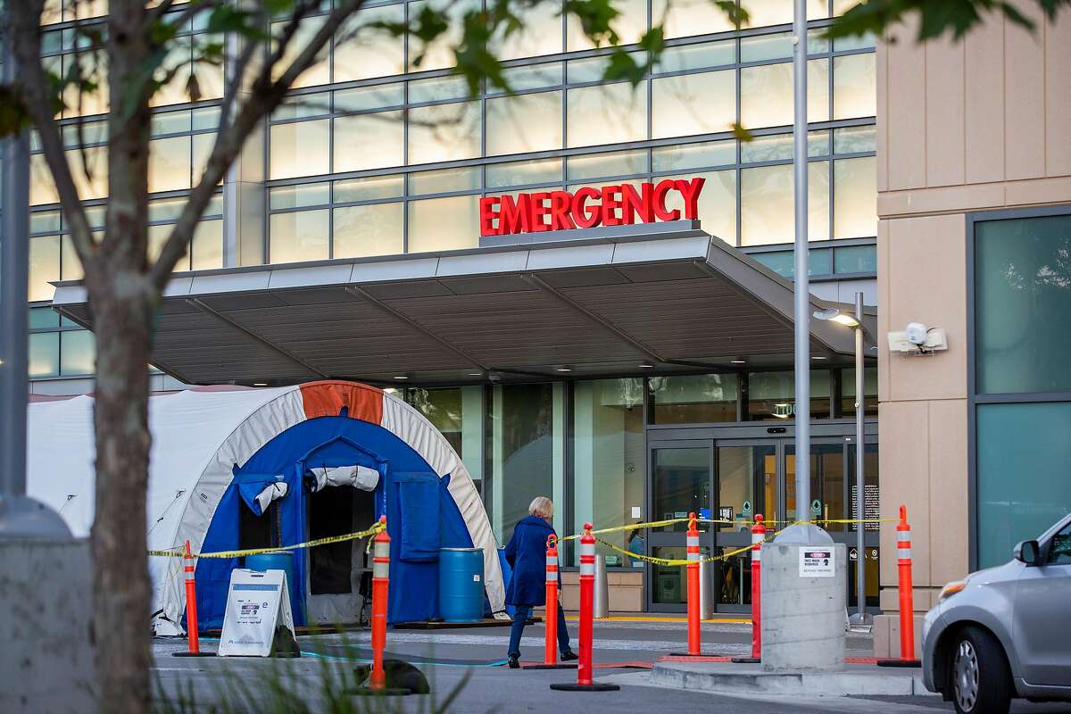 Tents outside the emergency room at Kaiser Permanente for overflow of COVID-19 patients at the hospital, Thursday, Nov. 19, 2020, in Redwood City, Calif.