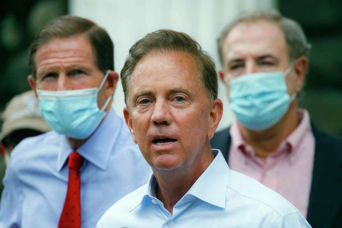FILE- In this Aug. 7, 2020, file photo, Connecticut Gov. Ned Lamont addresses the media in Westport, Conn. On Wednesday, Nov. 25, 2020, Lamont imposed a steep new $10,000 fine on businesses that break the state's coronavirus rules. He said that the heftier fine is needed because some businesses have flagrantly violated the rules, and there are concerns for worker and customer safety during the holiday shopping season. (AP Photo/John Minchillo, File)