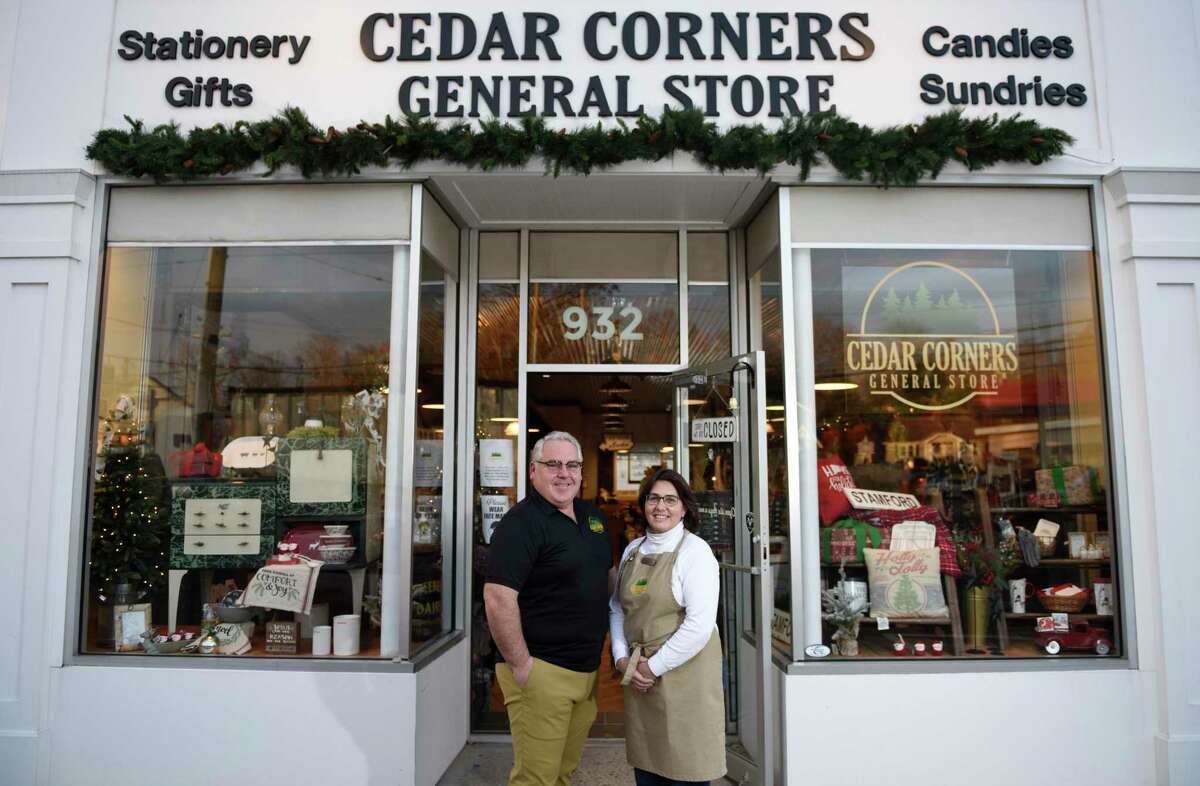 Owners Michael and Liz Sweeney pose at the new Cedar Corners General Store in Stamford, Conn., on Tuesday, Nov.17, 2020. Located at 932 High Ridge Road, the store featuring gifts, provisions, candy, and clothing hopes to “take a journey back to that simpler time and experience a blend of local, unique and fun gifts and accessories in an upbeat, old time turn-of-the-century charm.”