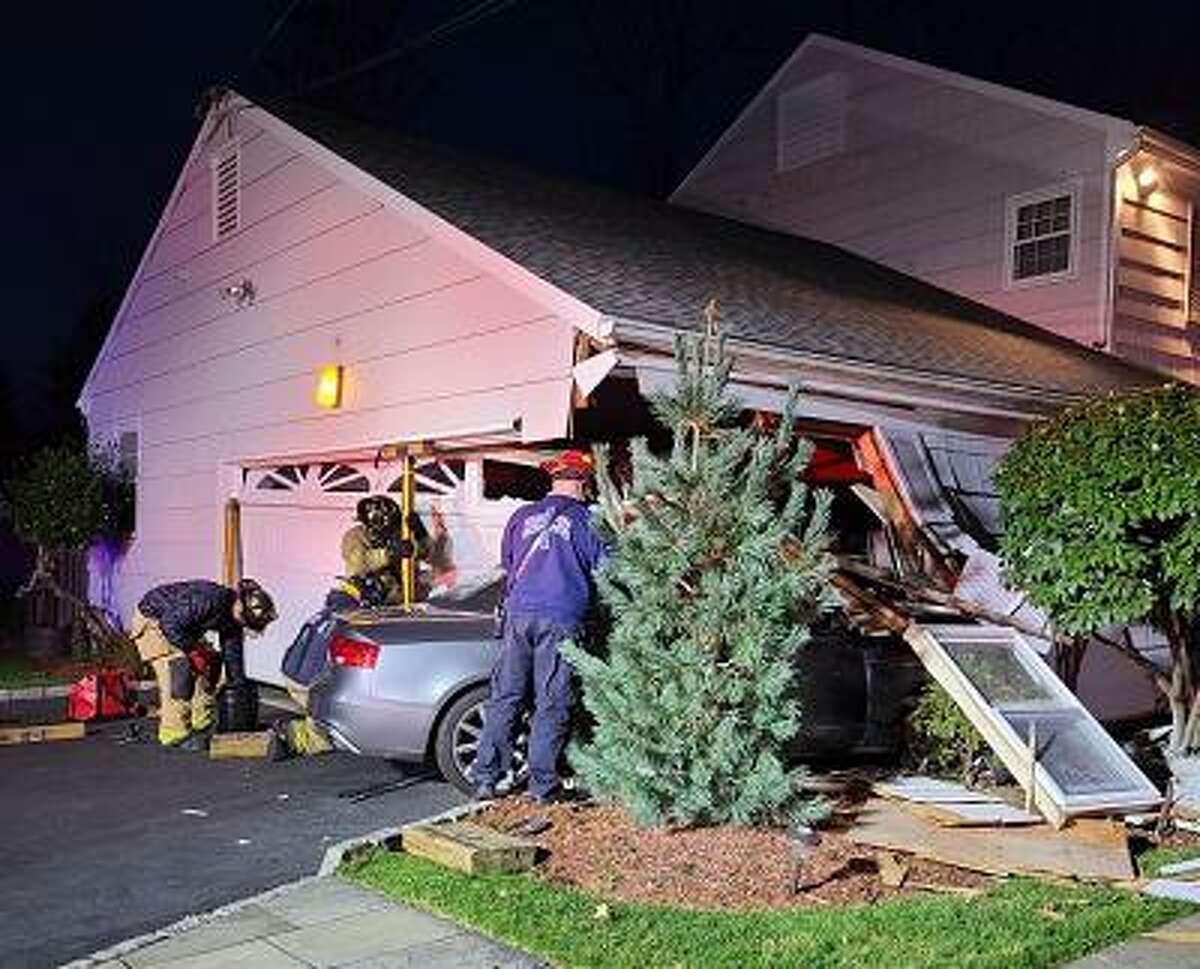 A vehicle slammed into a garage attached to a home in North Stamford.