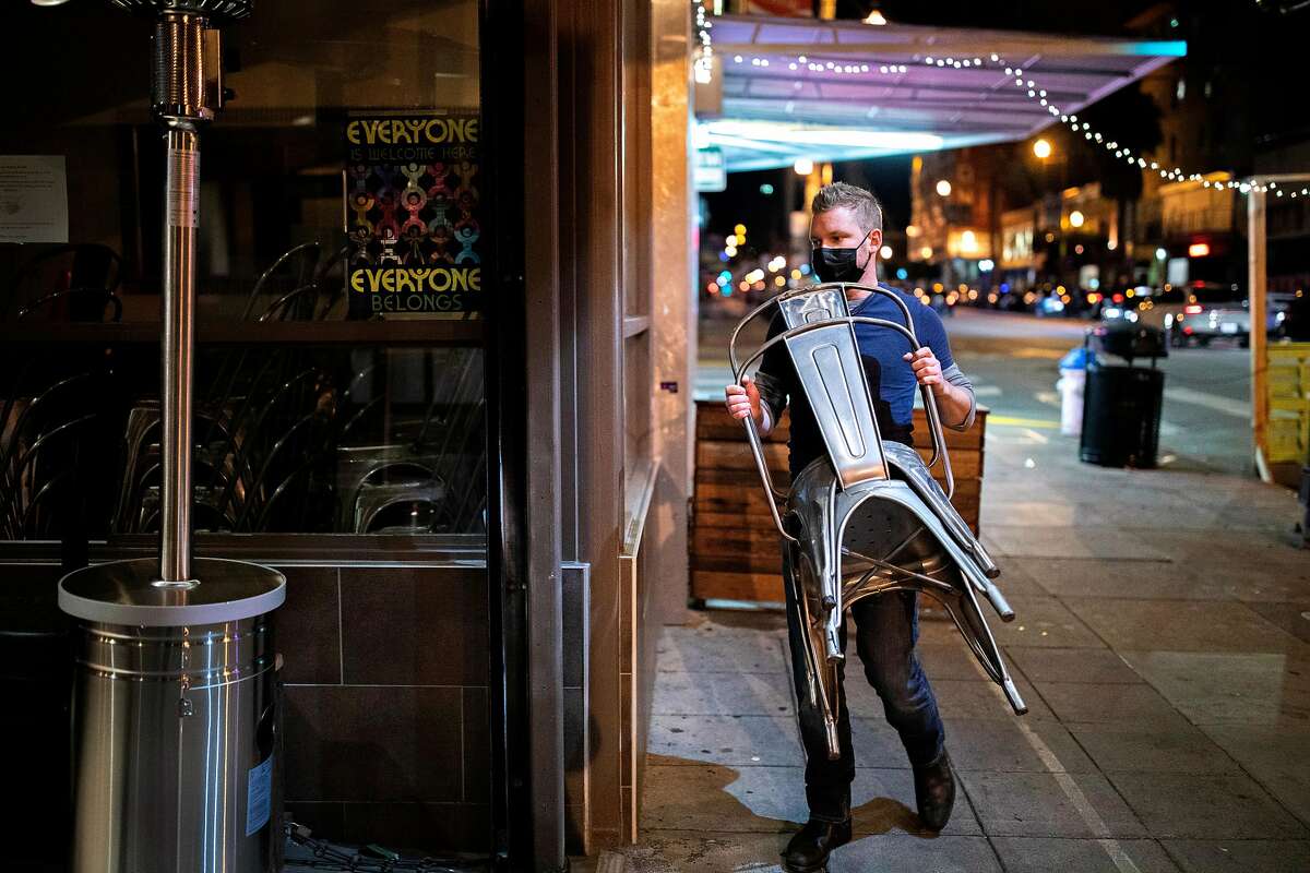 Manager Shane Baldwin removes the outdoor dining area and closes Myriad Gastropub in San Francisco on Nov. 20.