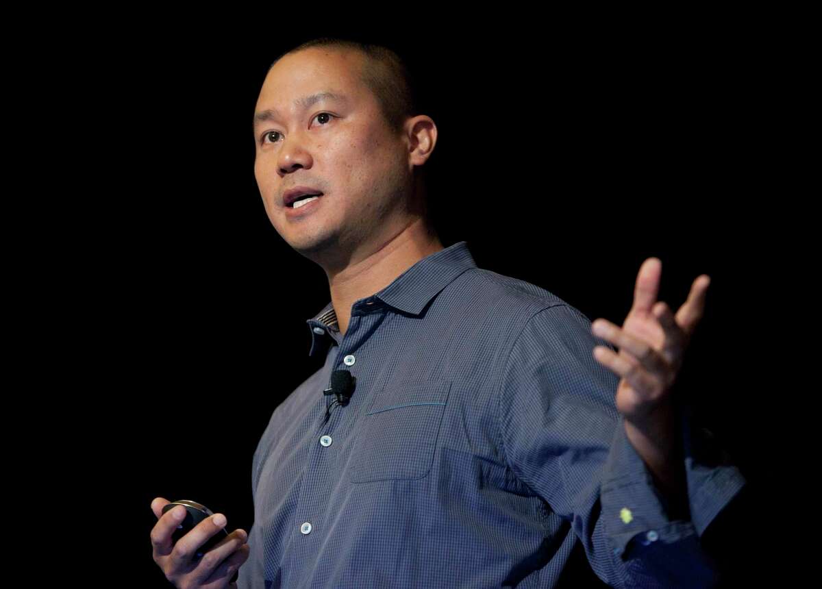 FILE - In this Sept. 30, 2013, file photo, Tony Hsieh speaks during a Grand Rapids Economic Club luncheon in Grand Rapids, Mich. Hsieh, retired CEO of Las Vegas-based online shoe retailer Zappos.com, has died. Hsieh was with family when he died Friday, Nov. 27, 2020, according to a statement from DTP Companies, which he founded. Downtown Partnership spokesperson Megan Fazio says Hsieh passed away in Connecticut, KLAS-TV reported. Hsieh recently retired from Zappos after 20 years leading the company. He worked to revitalize the Las Vegas area.