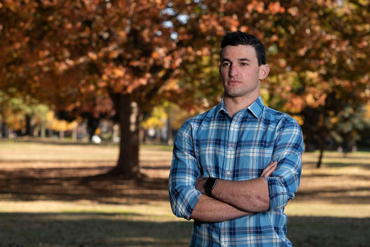 Taylor Nichols, an emergency physician, poses for a portrait at McKinley Park in Sacramento, Calif. on Monday November 30, 2020. Taylor Nichols is a Jewish ER doctor, from the Bay Area, now at a hospital near Sacramento who wrote a gut-wrenching twitter post about treating a Nazi guy who likely had covid and his hesitancy and exhaustion.