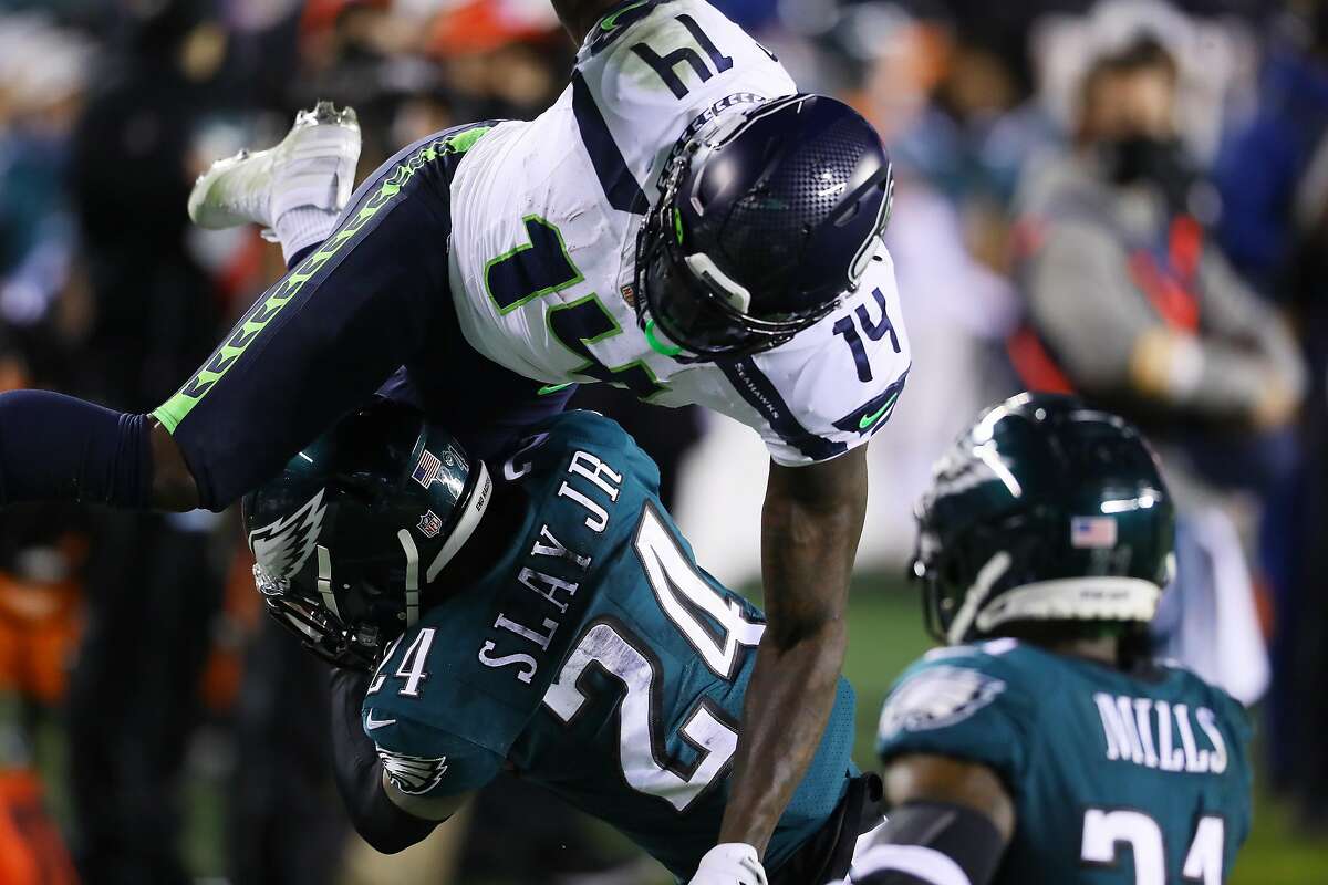 PHILADELPHIA, PENNSYLVANIA - NOVEMBER 30: DK Metcalf #14 of the Seattle Seahawks goes up and over Darius Slay #24 of the Philadelphia Eagles during the second quarter at Lincoln Financial Field on November 30, 2020 in Philadelphia, Pennsylvania. (Photo by Mitchell Leff/Getty Images)