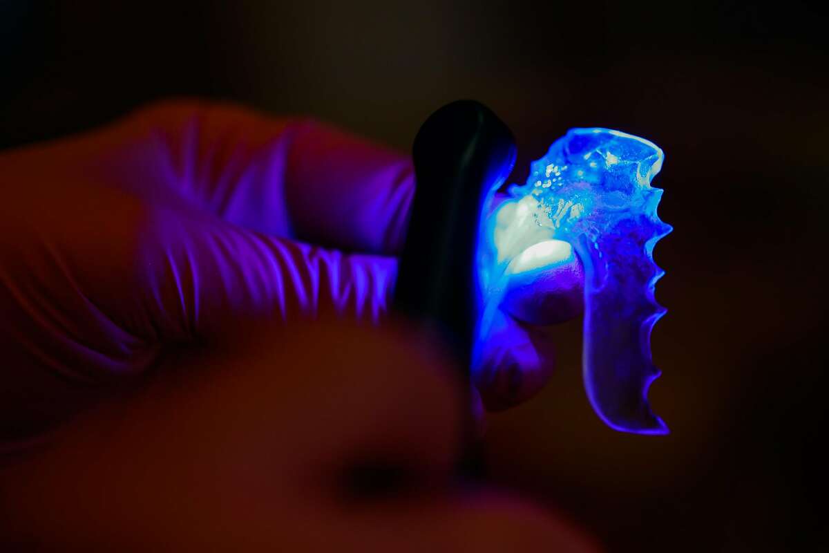 Dr. Cynthia Brattesani custom fits a patient with a new mouthguard to prevent her from clenching her jaw on Monday, Nov. 30, 2020 in San Francisco, California.
