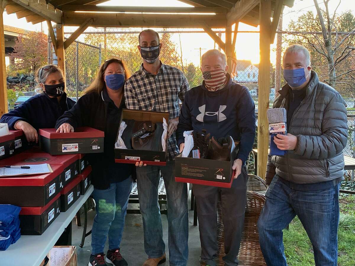 General Needs Ltd., a group which focuses on helping homeless Long Island veterans and their families, recently donated a large amount of shoes and socks to Homes for the Brave in Bridgeport. Pictured far right is General Needs founder Lonnie Sherman. Homes for the Brave board president Robert Kozlowsky is pictured third from left.