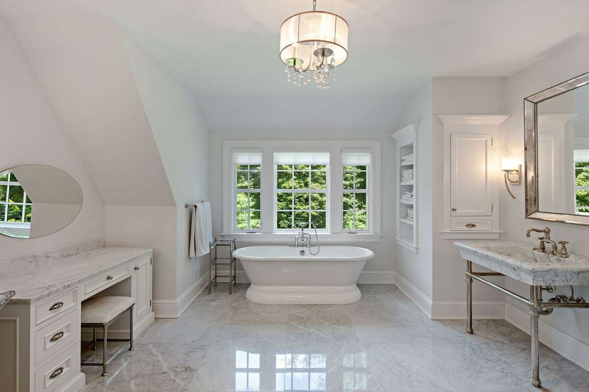 The marble master bath features a steam shower, soaking tub, a dressing table, and a pair of marble pedestal sinks. The Lillian Wadsworth Arboretum is also quite close by. The 62-acre wildlife sanctuary and 12-acre arboretum are within walking distance and are well worth the effort, although this home sits on a private one-acre level property that is a sanctuary of its own.
