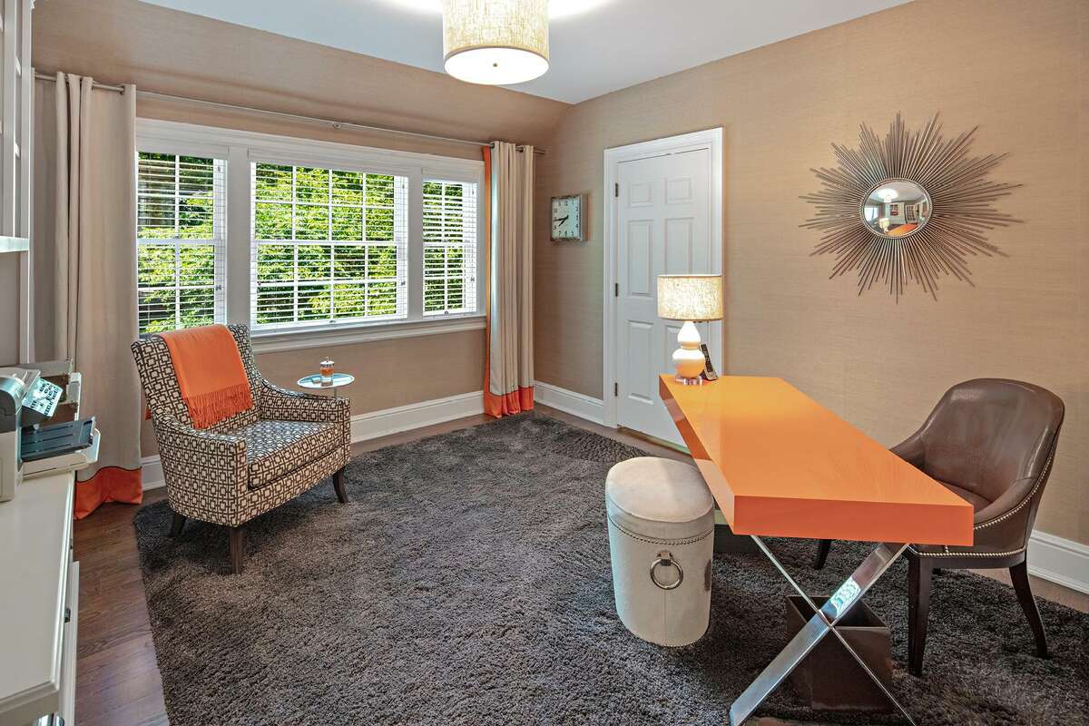 Off the master bedroom suite there is a room that could serve as a sitting room, nursery, or as a second home office or study.