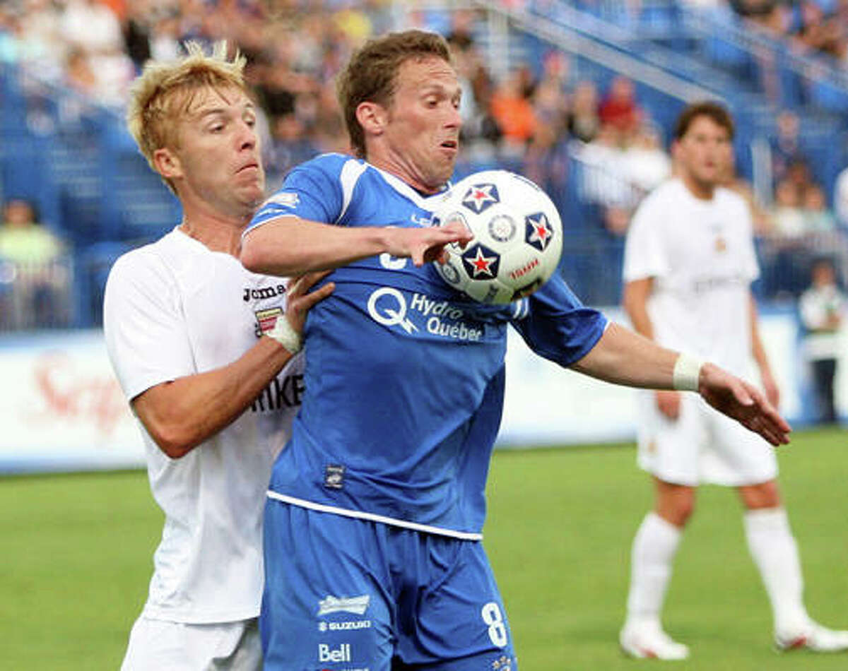 Edwardsville graduate Luke Kreamalmeyer, right, of the Montreal Impact tries to control the ball against the Fort Lauderdale Strikers in NASL action in July 2011 in Montreal.