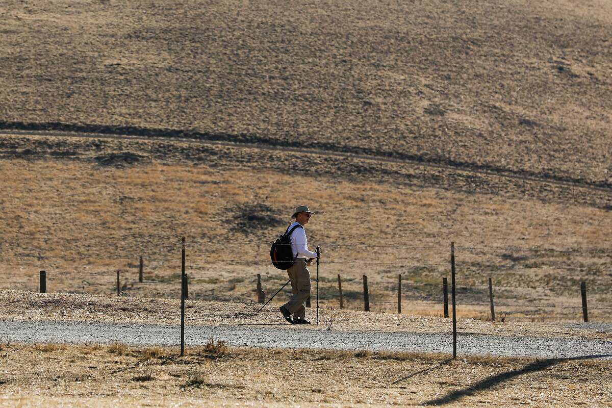 Mark Kluver hikes on a trail in Brushy Peak Regional Preserve on Nov. 16 in Livermore. The Bay Area and most of the Golden State are bracing for a rain-free few weeks, adding to what has already been an abnormally dry rainy season, meteorologists said.
