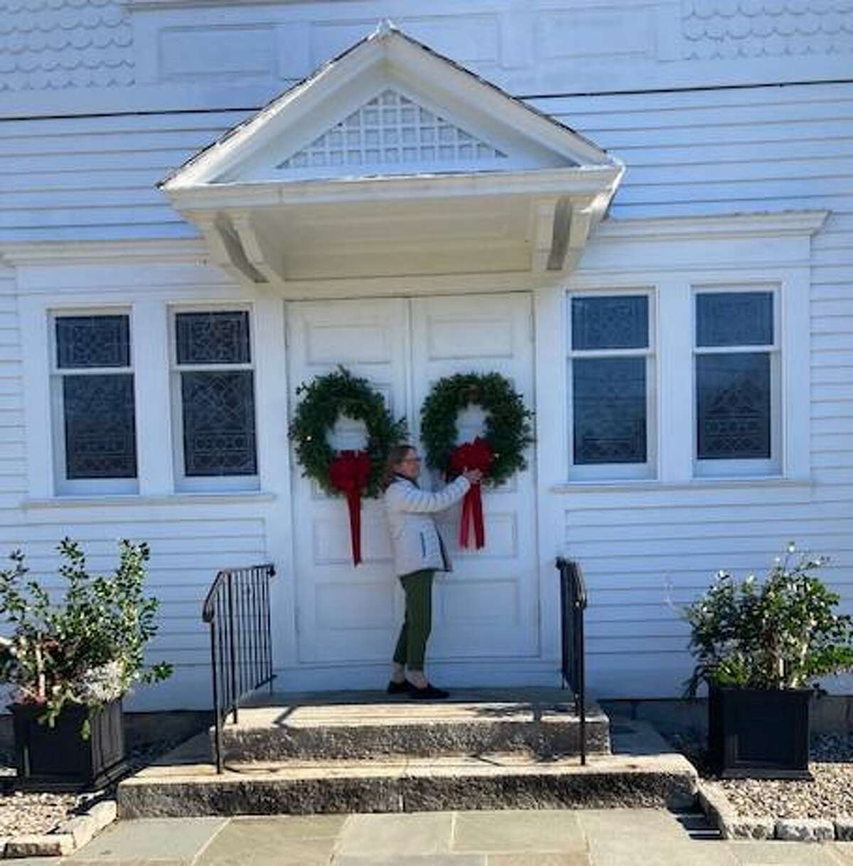 Members of the Sherman Congregational Church recently decorated for Advent last weekend. Planters of greens, arranged by Lynne Gomez, were placed by the front and side doors and Anna Galasso placed wreaths on the front door, above. November 2020