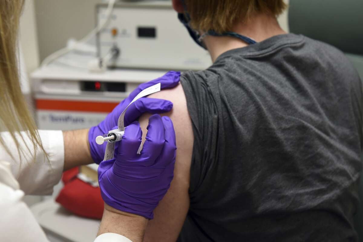 This May 4, 2020, file photo provided by the University of Maryland School of Medicine, shows the first patient enrolled in Pfizer's COVID-19 coronavirus vaccine clinical trial at the University of Maryland School of Medicine in Baltimore.