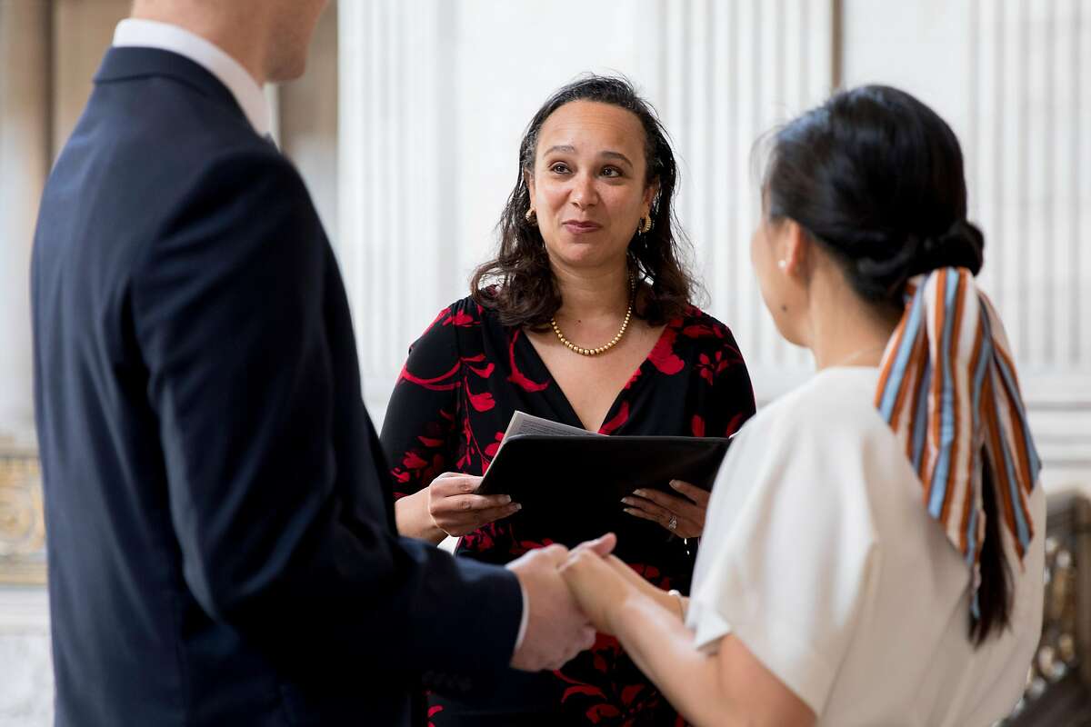 San Francisco City Administrator Naomi Kelly, whose husband has been charged with accepting bribes, officiates a wedding in City Hall in 2020. Kelly notified Mayor London Breed that she would leave her post effective Feb. 1.