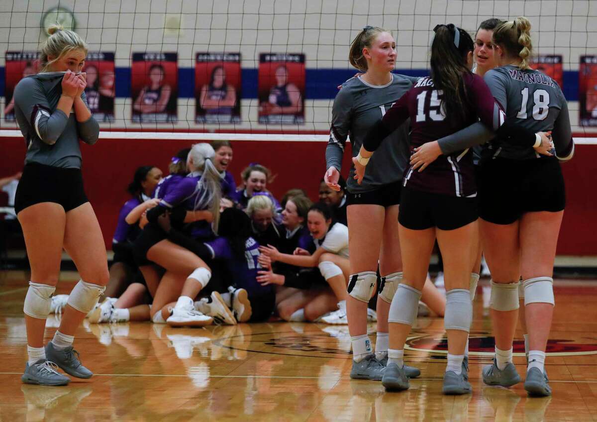 Magnolia players react after losing to Fulshear in five sets during a Region III-5A semifinal high school volleyball playoff match at Cypress Springs High School, Tuesday, Dec. 1, 2020, in Cypress.