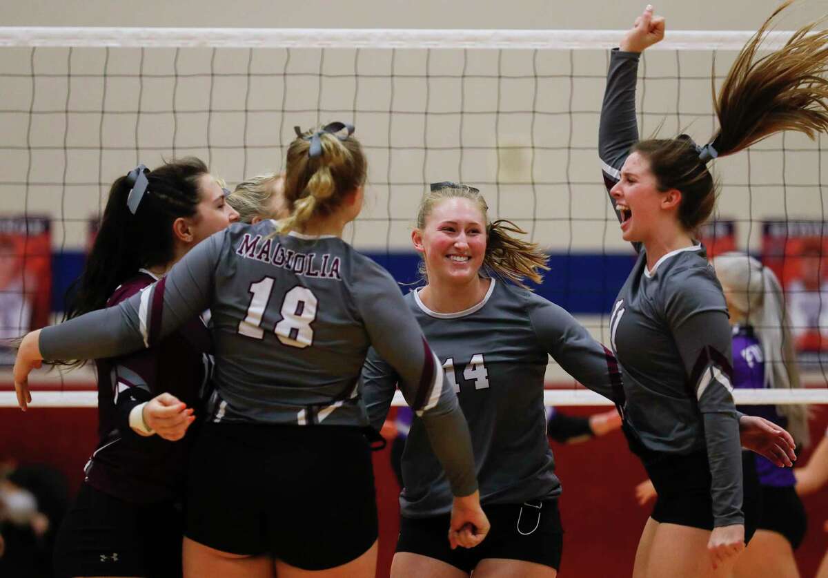 Magnolia setter Faith Lynch (11) reacts after scoring a point during the first set of a Region III-5A semifinal high school volleyball playoff match at Cypress Springs High School, Tuesday, Dec. 1, 2020, in Cypress.