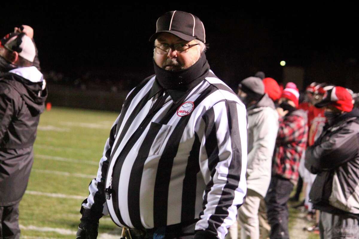 Mark Schoenfelder of Greenville gets ready to officiate a Reed City playoff game earlier this season. (Herald Review photo/John Raffel)